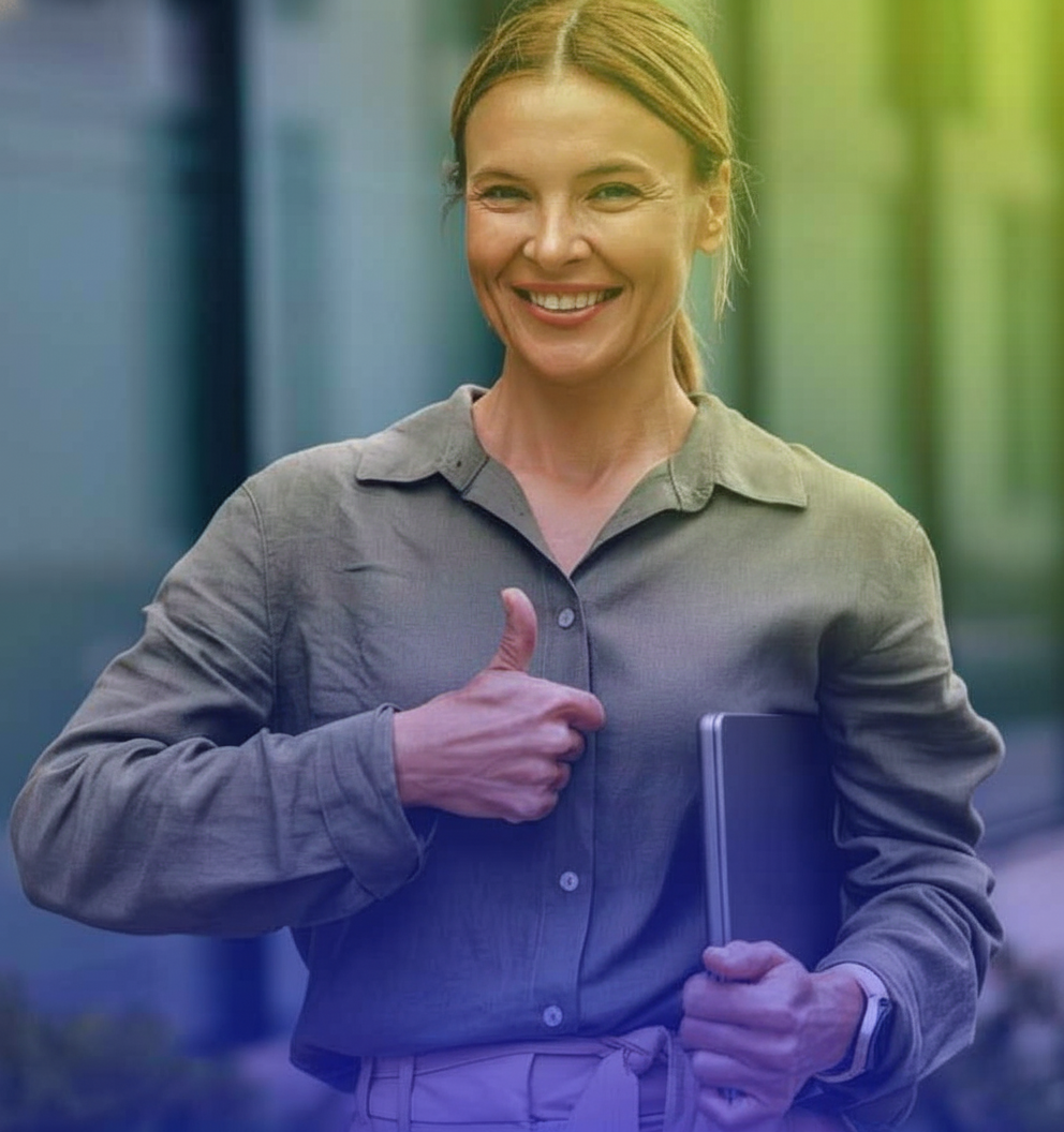 A confident and smiling businesswoman giving a thumbs-up while holding a laptop, with a modern blue and light green color overlay on the image.